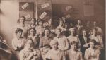 Fig.17 - At the munitions factory c.1915. (Helen and May are near the middle of the back row in head-scarves, Helen is on the right.)